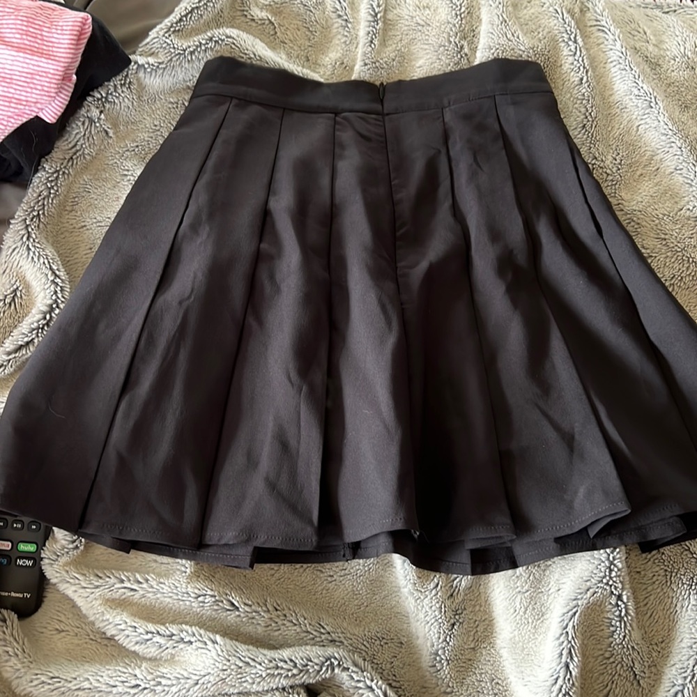 super cute pleaded skirt. really cute with fishnets and boots!